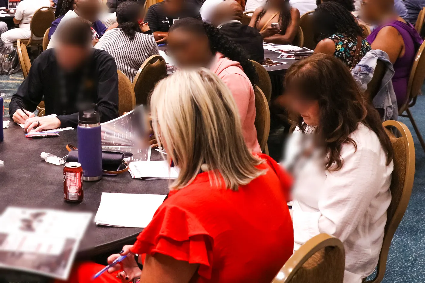 Educators coaching one another in a working session